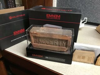 Eminem Signed Authenticated Brick And Dog Tag From Slim Shady’s Childhood Home.
