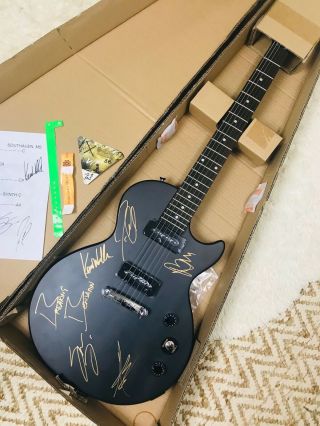 Matte black electric guitar autographed by Breaking Benjamin Rock Band. 4