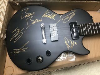 Matte black electric guitar autographed by Breaking Benjamin Rock Band. 8