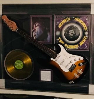 Jimi Hendrix Memorabilia With Vinyl,  Photo,  & Guitar