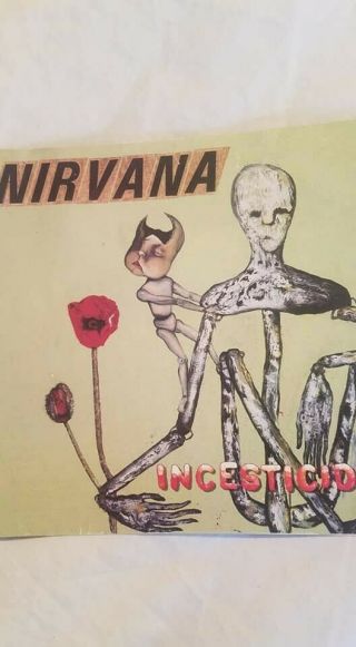 Kurt Cobain and Krirst Novoselic Signed CD Booklet 4