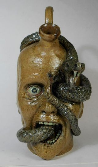 Folk Art Pottery Snake Eye Face Jug By Vonderhey