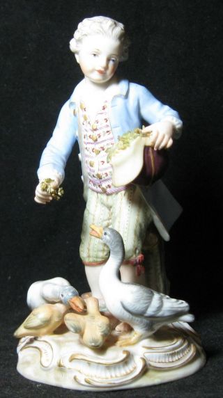 A Meissen German Porcelain Figurine Of Boy Feeding Ducks