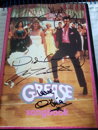 Grease Songbook Signed By John Travolta.  Olivia Newton John.  Stockard Channing
