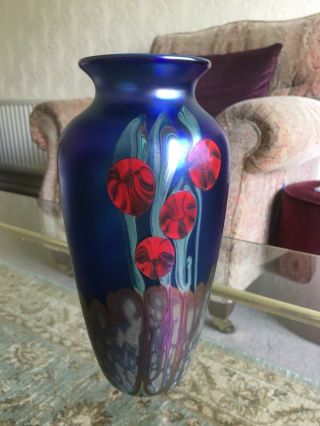Okra Glass A Signed 8 1/2” Blue Iridescent Vase With Red Flowers C1992