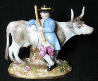 A German Meissen Porcelain Figurine Of A Farmer With Cow Figure