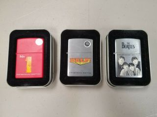 3 The Beatles Zippo Lighters Help,  2002 Apple Corps,  Beatles One