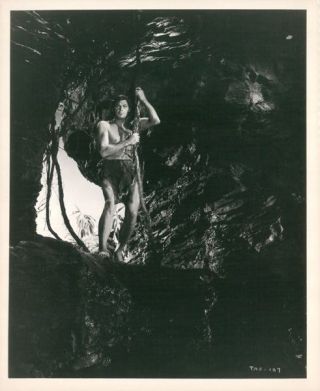 Johnny Weissmuller Holding Vine In Cave Tarzan And The Amazons 8x10