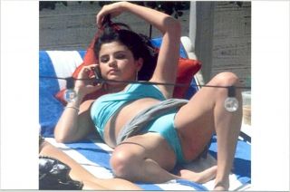 Selena Gomez - In A Blue Bikini - Legs Open