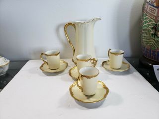 T & V Limoges 8 1/2 " Pitcher And 4 Cups And Saucers