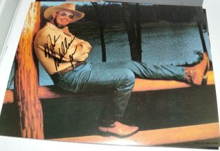 Hank Williams Jr Signed Photograph 8x10 " Lounging Riverside W/ Boots N Hat