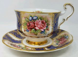 Paragon Blue And Gold Footed Cup & Saucer With Large Roses