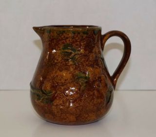 Ned Foltz Pottery Redware Pitcher with floral pattern,  signed and dated 2000 3