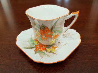 Shelley Demitasse Orange Violets And Butterfly Teacup And Saucer.