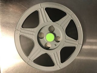 10.  5” Gray plastic film reel 16MM with film and case 2