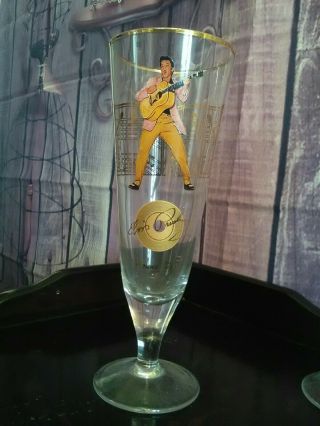 Two highly collectible decorated tall footed Elvis Presley glasses. 4