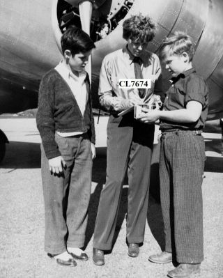 Amelia Earhart Signing Autographs For Children Photo