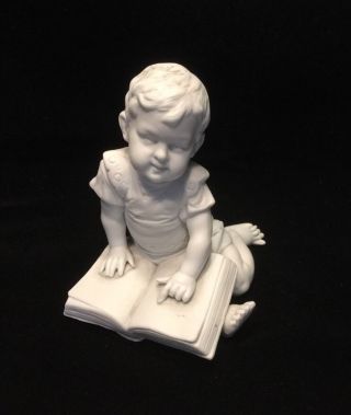 Antique German White Bisque Porcelain Of Young Child Figure With Book.  1205