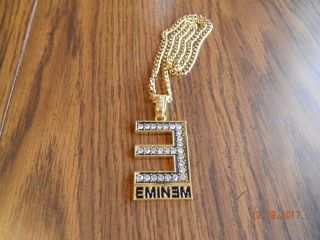 - Eminem Logo Gold Tone Pendant W/ Matching 24 Inch 4mm Cuban Chain