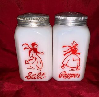 Hazel Atlas Red Skating Dutch Milk Glass Salt And Pepper Shakers
