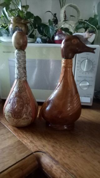 1duck And 1lion Motif Decanter Antique Leather Wrapped Glass Bottle.  Both $35
