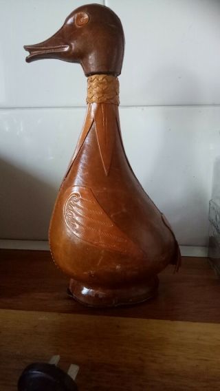 1Duck and 1Lion motif Decanter Antique Leather Wrapped Glass Bottle.  Both $35 2