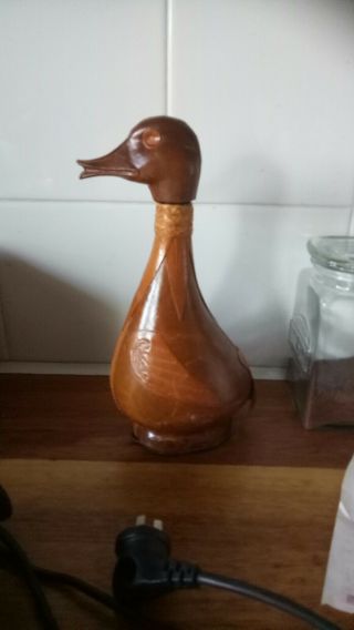 1Duck and 1Lion motif Decanter Antique Leather Wrapped Glass Bottle.  Both $35 3