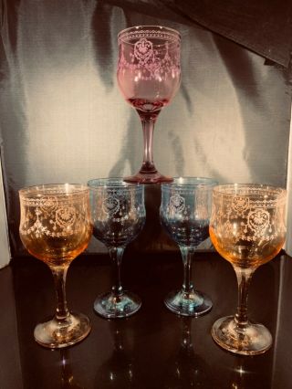 5 Vintage Italian wine glasses,  2 blue,  2 peach,  1 purple,  6 1/2” high 2