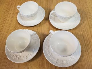 Wedgwood Of Etruria & Barlaston Embossed Queensware Cups And Saucers