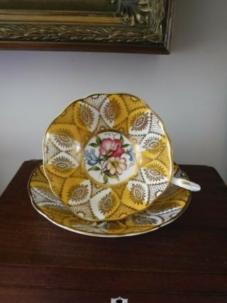 Paragon Bone China Cup And Saucer Yellow And Gold With Floral Center