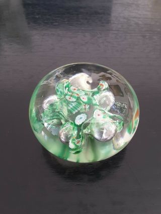 A Vintage Art Glass Paperweight With Millefiori Slices And Bubbles