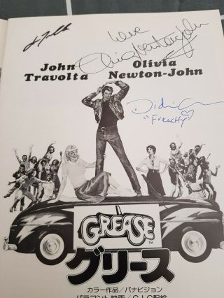 GREASE 1978 MOVIE BOOK SIGNED BY JOHN TRAVOLTA.  OLIVIA NEWTON JOHN.  DIDI CONN. 4
