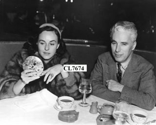 Paulette Goddard In A Fur Coat And Charlie Chaplin Dining At Musso & Frank Grill