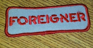 Foreigner - Early 80s Vintage Logo Iron - On Patch And Vintage 80s Logo Button Pin