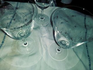 12 German Crystal Water/ Wine Long Stem Glasses.  Starburst etched.  Clear ringing 4
