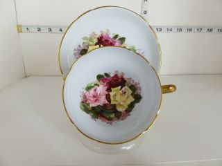 Vintage Stanley Roses Cup And Saucer On A Light Blue Back Ground