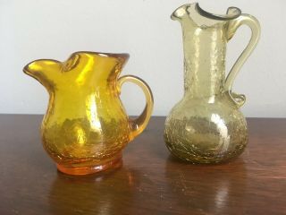 2 Miniature Blown Amber Crackle Glass Pitchers With Applied Handles