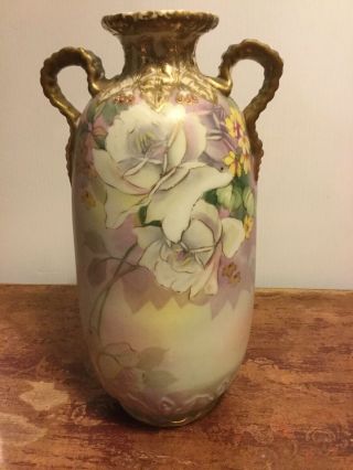 Antique hand painted Nippon Porcelain Vase w/ribbon handles 10.  5 