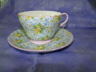 Ex Shelley Primrose Chintz Tea Cup & Saucer Yellow/blue Flowers W/pink Trim