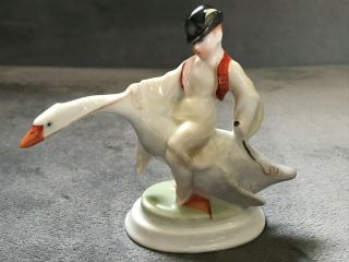 Herend Hungary Hand Painted Porcelain Figurine Of A Boy Riding A Goose.