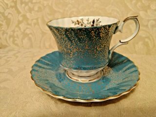 Queen Anne Bone China Cup & Saucer Gold Scrollwork On Blue Background England