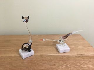 Two Glass Animals On Marble Bases - A Cat And A Swan