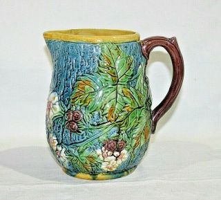 Old Stoneware Majolica Glaze Pitcher With Floral Pattern