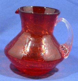 3.  5 Inch Red Orange Crackle Glass Pitcher Applied Handle Very Pretty