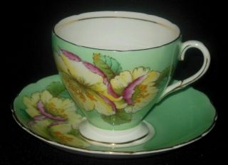 E B Foley Hand Painted Green Tea Cup Saucer Wild Yellow Lavender Roses 1948